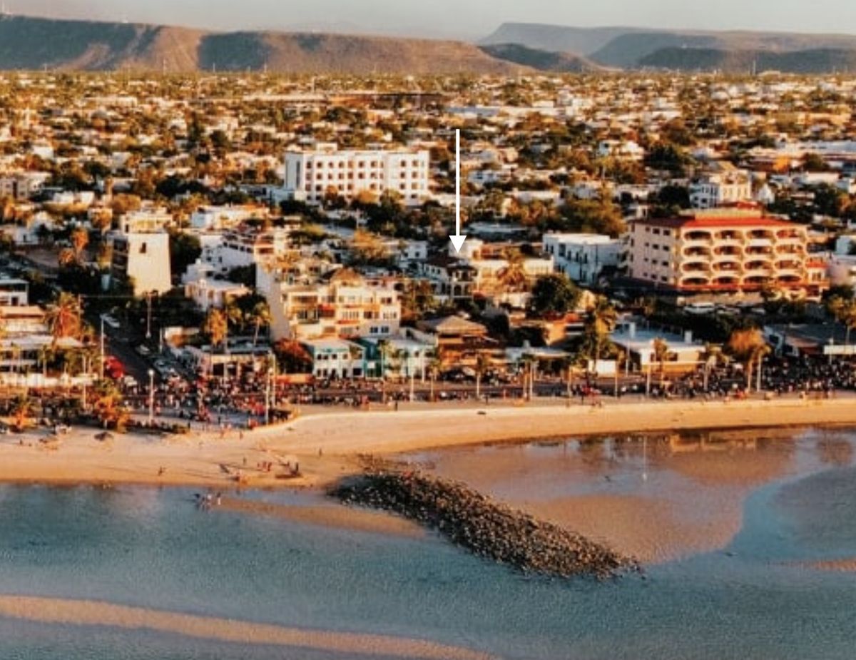 Aerial view of central La Paz with an arrow marking Colibri Centro, one block back from the Malecón
